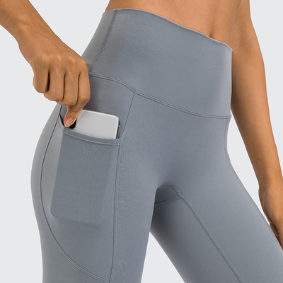 Hip Lifting High Waisted Tights Pants Nylon Women's Yoga Pants With Side Pockets